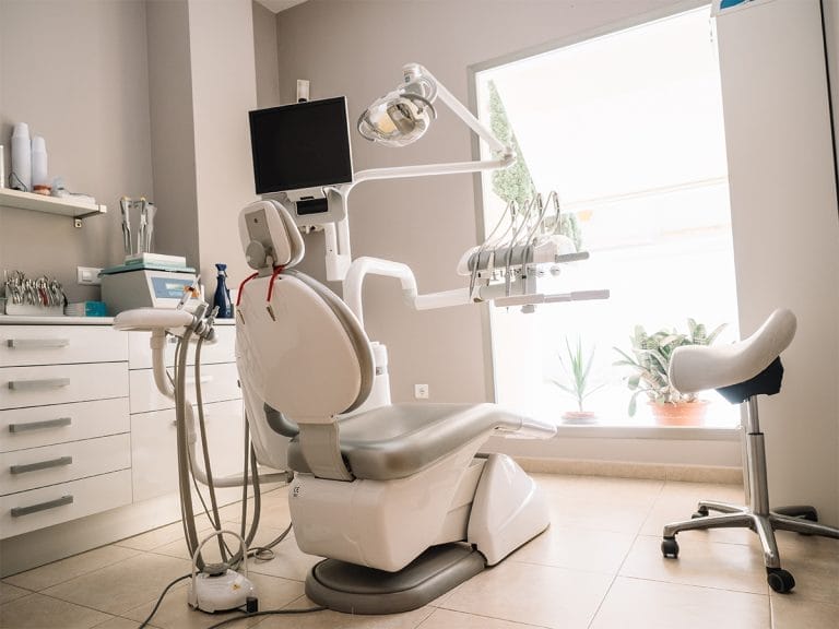 A dentist's clinic. Working armchair with utensils and tools.